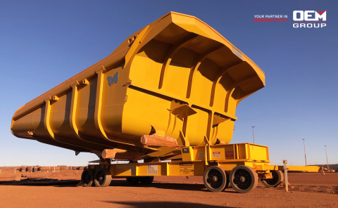 Tray transporter in red dirt on mine site